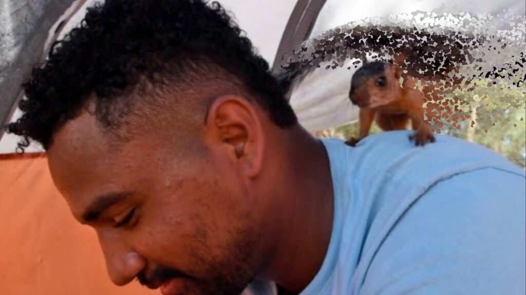 Venezuelan migrant Yeison with his pet squirrel Niko