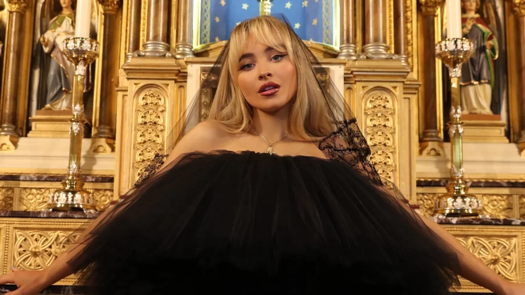 Catholic Priest Punished For Allowing Sabrina Carpenter To Shoot Feather MV in Church