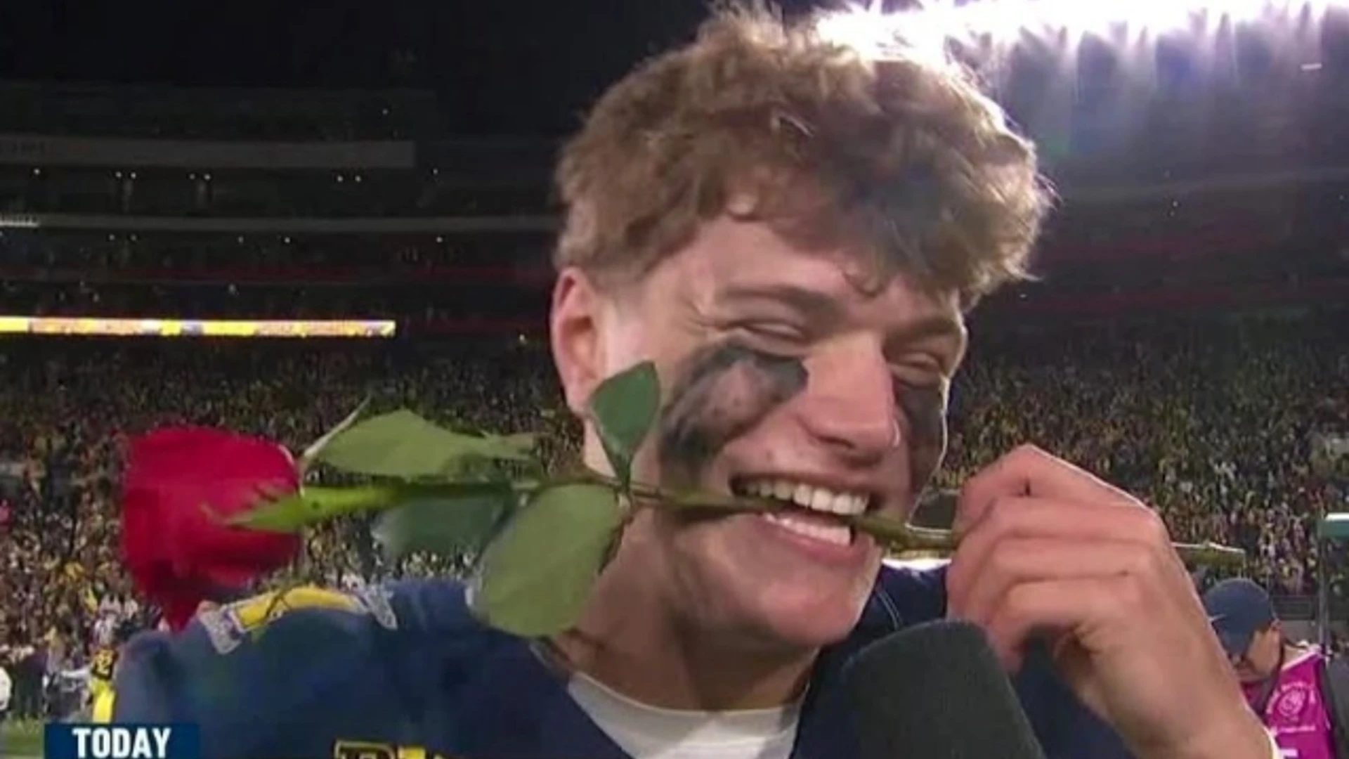 JJ McCarthy rose bowl rose on teeth